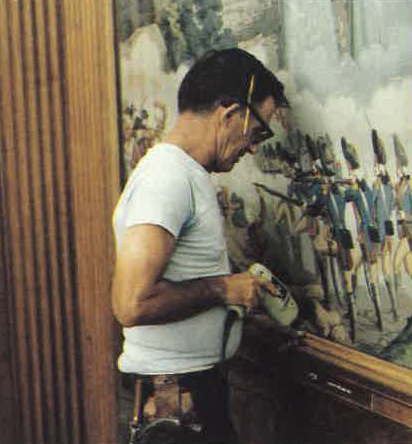 Bob Johnson installs the new wood Fram around the panels 